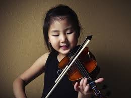 young asian kid playing violin