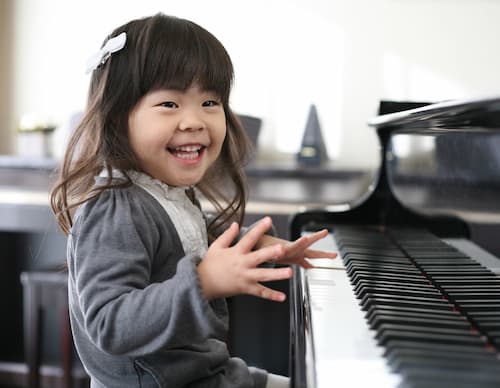 Girl taking music lessons