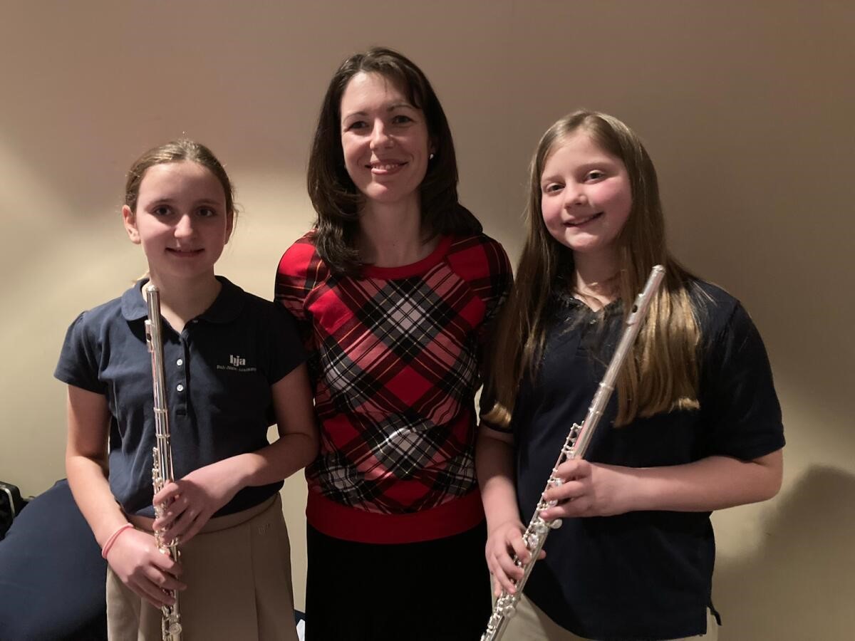 children learning to play the flute