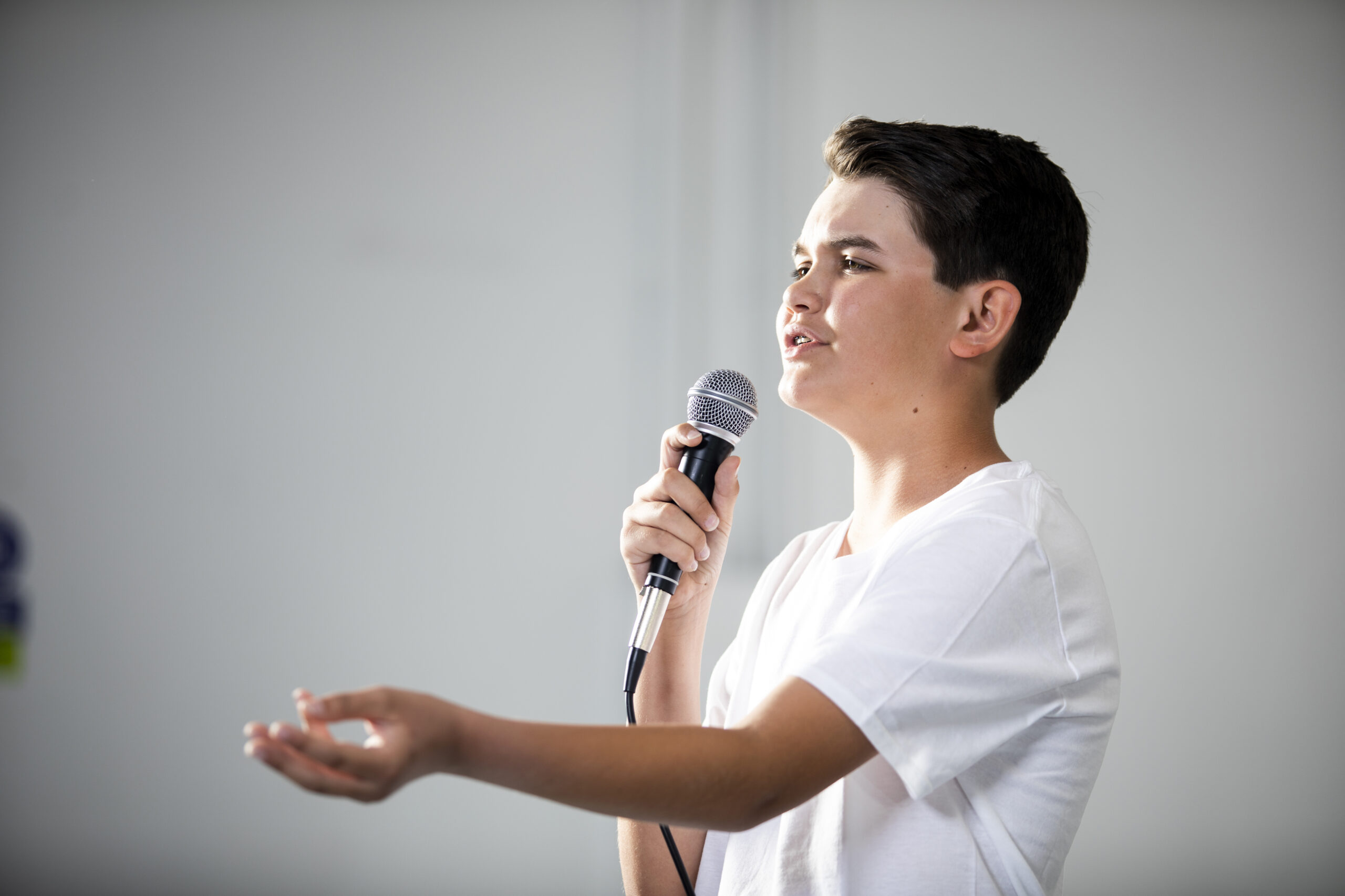 Teenage Boy Singing in Studio