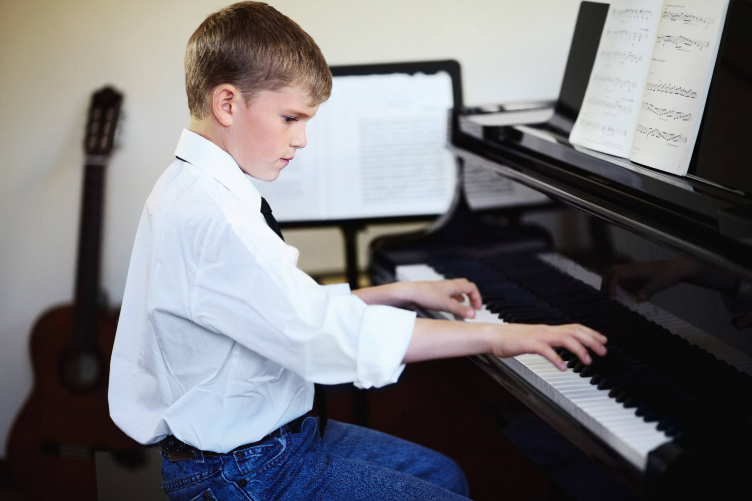 Young boy playing the piano