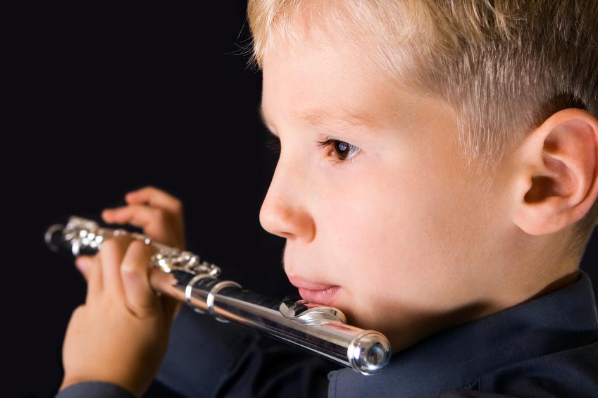 kid playing the flute