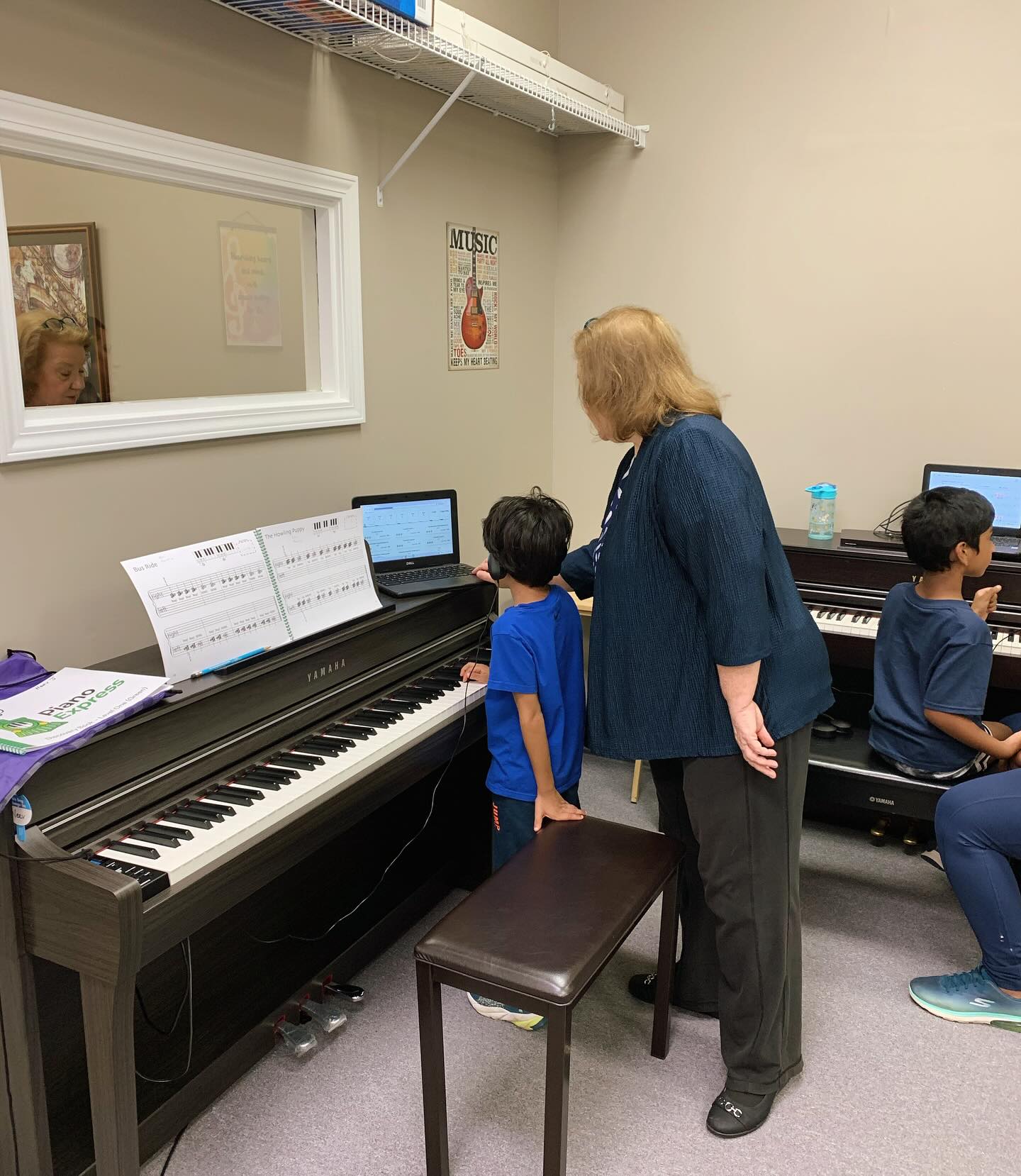 Gina teaching Piano Express